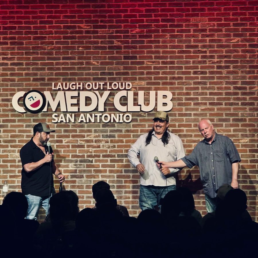 Big Al on stage with Steve Treviño at a comedy class showcase at the LOL Comedy Club